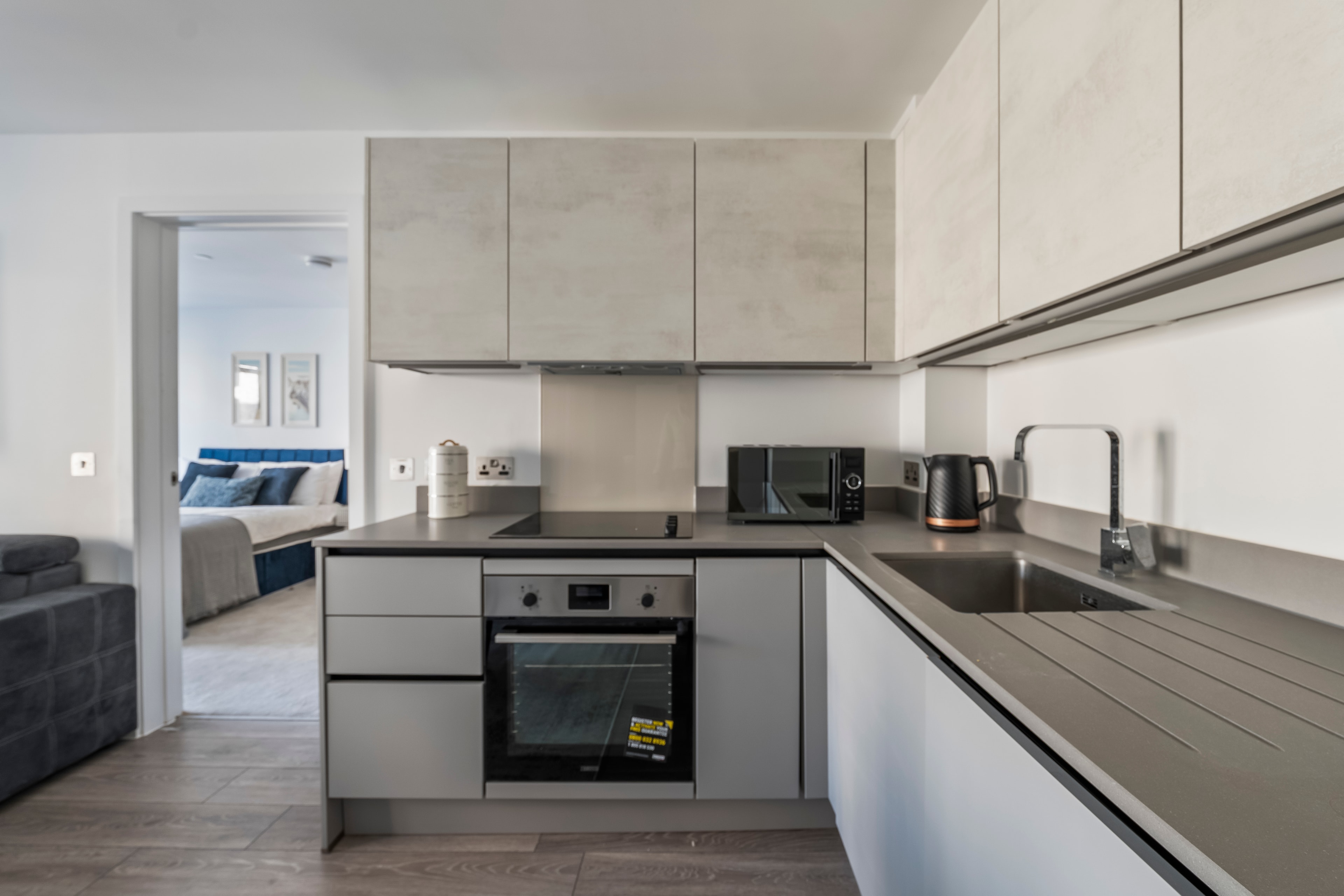 Modern fitted kitchen with oven and appliances
